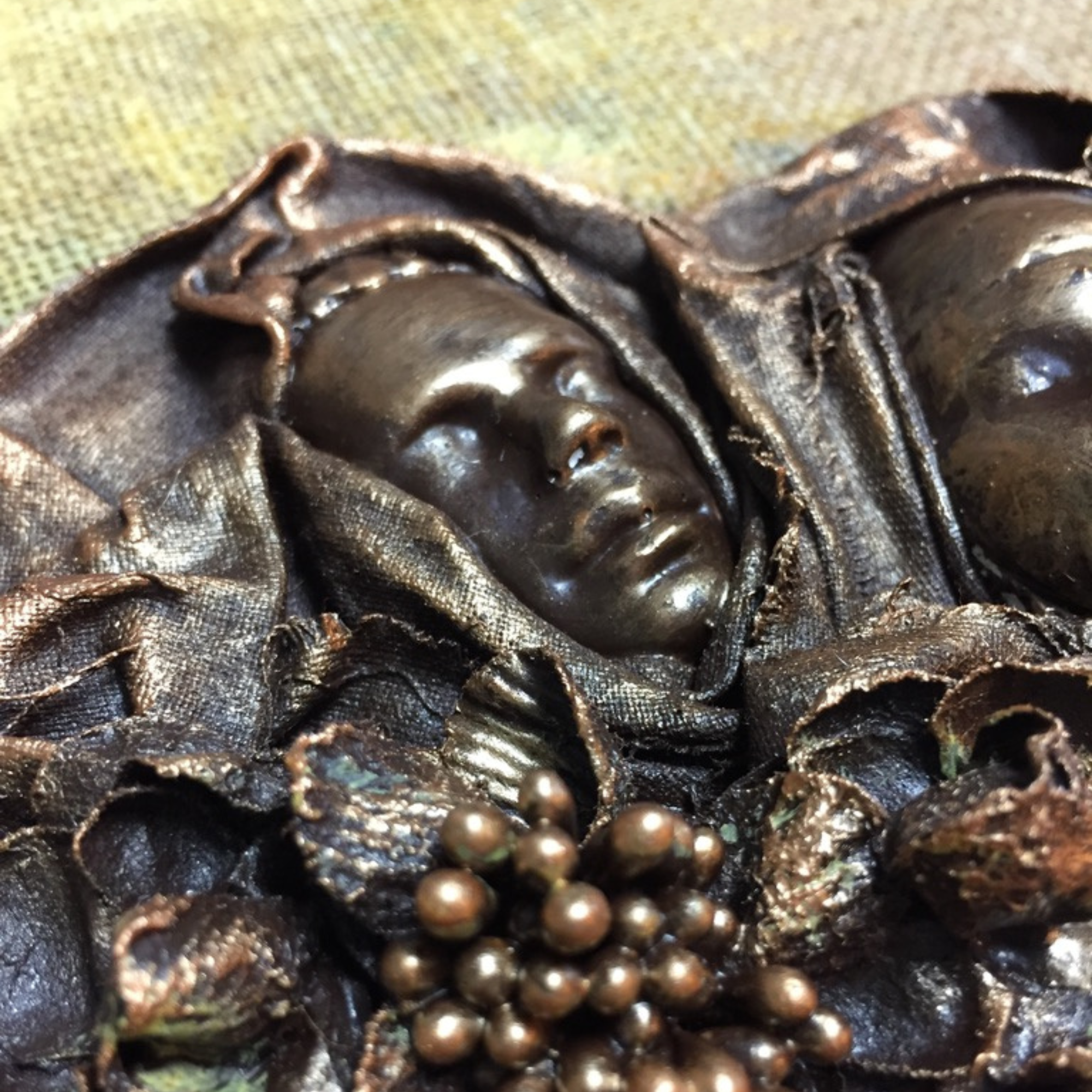 Pictured Artwork: Flat back plaster male head on canvas.